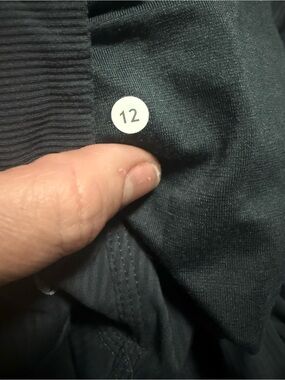 Lululemon Dark gray studio pants very faint pinstripes in size 12.